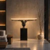 Humano Squatting sculptural floor lamp displayed in a contemporary living room