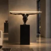Humano Squatting floor lamp with Gunmetal figure and Black marble base in a modern interior