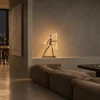 Humano Triangle sculptural floor lamp in a contemporary living room