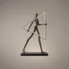Humano Triangle sculptural floor lamp with human figure and geometric illuminated frame