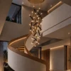 Kendra 24 sculptural chandelier suspended above a modern staircase
