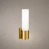 Kianna modern gold wall lamp featuring a cylindrical white glass shade and metallic base