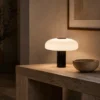 Kiel Black table lamp with dome-shaped shade in a modern interior