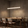 Kori 120 Gun Black chandelier above a contemporary dining table