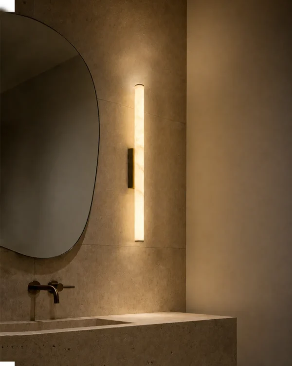 Leti vertical wall lamp beside a mirror in a modern bathroom