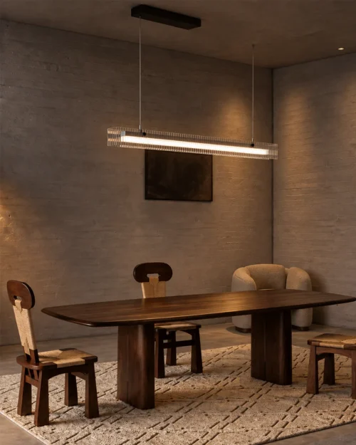 Linia Chandelier Dining Room Interior Linia linear chandelier suspended above a wooden dining table in a contemporary interior