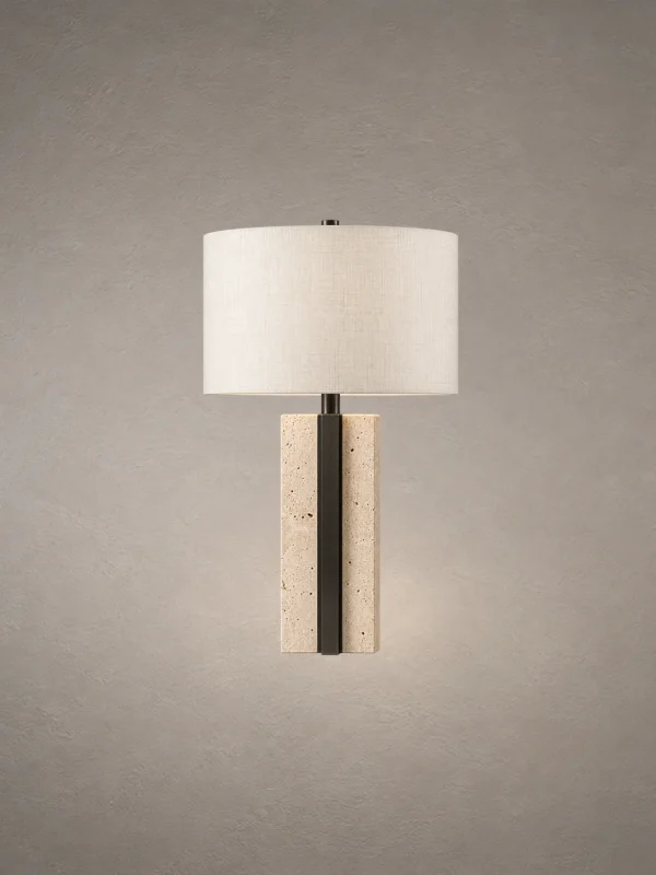 Lithos table lamp with cylindrical white fabric shade and textured stone-inspired base