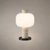 Milky Shine table lamp with rounded white shade and cylindrical body