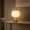 Milky Shine table lamp displayed on a console in a modern interior