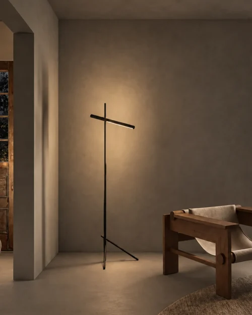 Mithra Floor Lamp Contemporary Interior Mithra linear floor lamp with black finish positioned beside a wooden bench in a modern interior