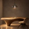 Monica Pendant Light Modern Dining Room Monica smokey grey glass pendant light suspended above a sculptural wooden dining table in a contemporary interior