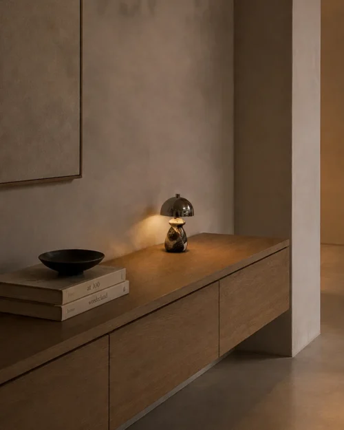 Nero Table Lamp Contemporary Console Nero table lamp with reflective metallic shade displayed on a wooden console