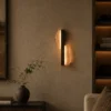 Offset Plate wall lamp illuminating a contemporary living room
