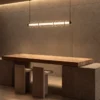 Orbis Horizontal Pendant Light above a contemporary dining table