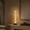 Orbis sculptural table lamp with stacked glass design in a modern interior