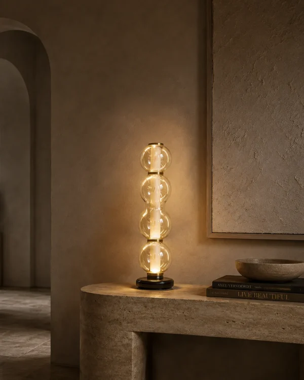 Orbis sculptural table lamp with stacked glass design in a modern interior