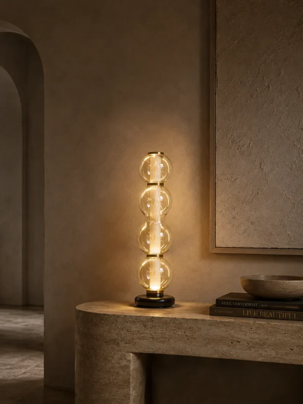 Orbis sculptural table lamp with stacked glass design in a modern interior