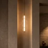 Orbis Vertical Pendant Light in Matte Brass and Cognac