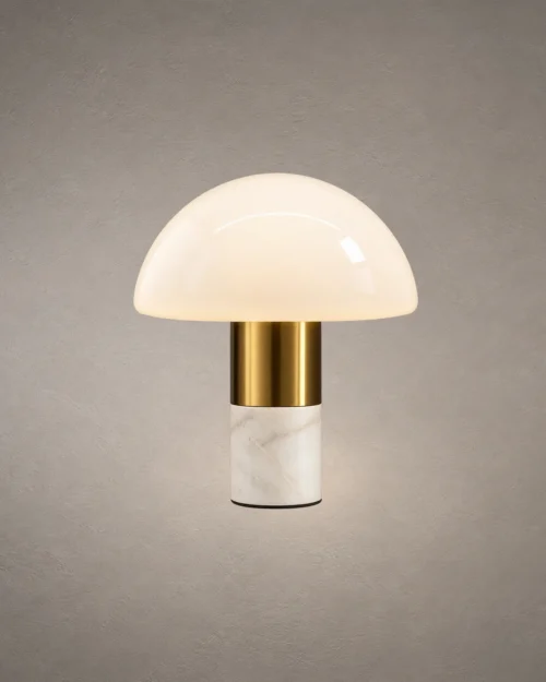 Orly modern table lamp with a white dome-shaped glass shade, gold metallic detailing, and white marble base
