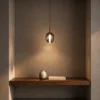 Osiris Pendant in Smokey Grey displayed in a modern interior