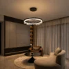 Pallas illuminated ring chandelier displayed in a modern interior with curved seating