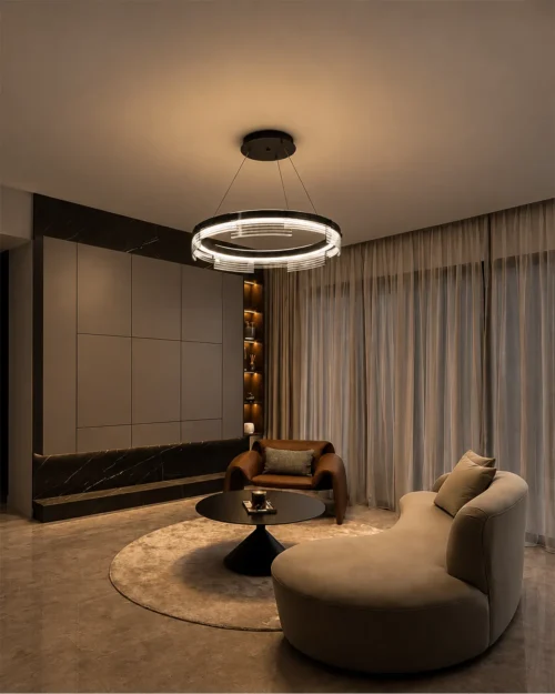 Pallas illuminated ring chandelier displayed in a modern interior with curved seating