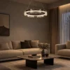 Pallas circular chandelier suspended above a contemporary living room seating area