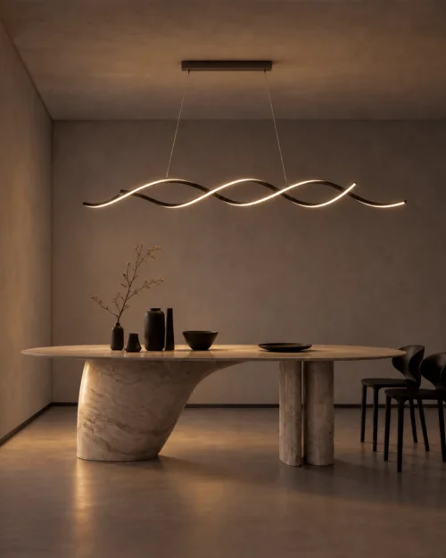 Palma wave-shaped LED chandelier suspended above a sculptural dining table