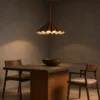 Pelias sculptural pendant light above a contemporary dining table