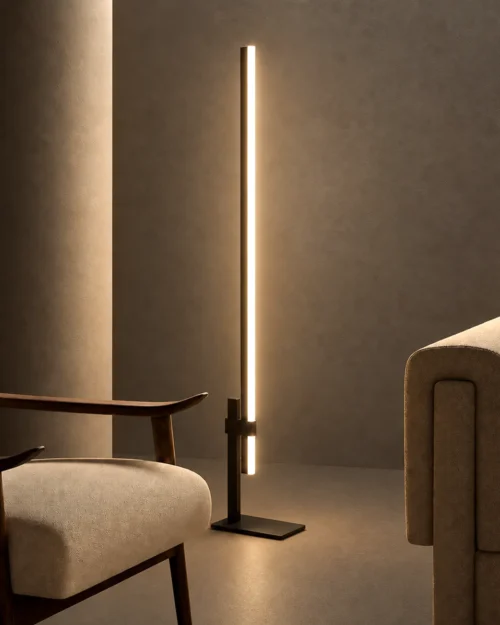 Perun minimalist floor lamp with Black and Coffee finishes beside modern upholstered seating