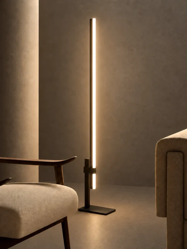 Perun minimalist floor lamp with Black and Coffee finishes beside modern upholstered seating