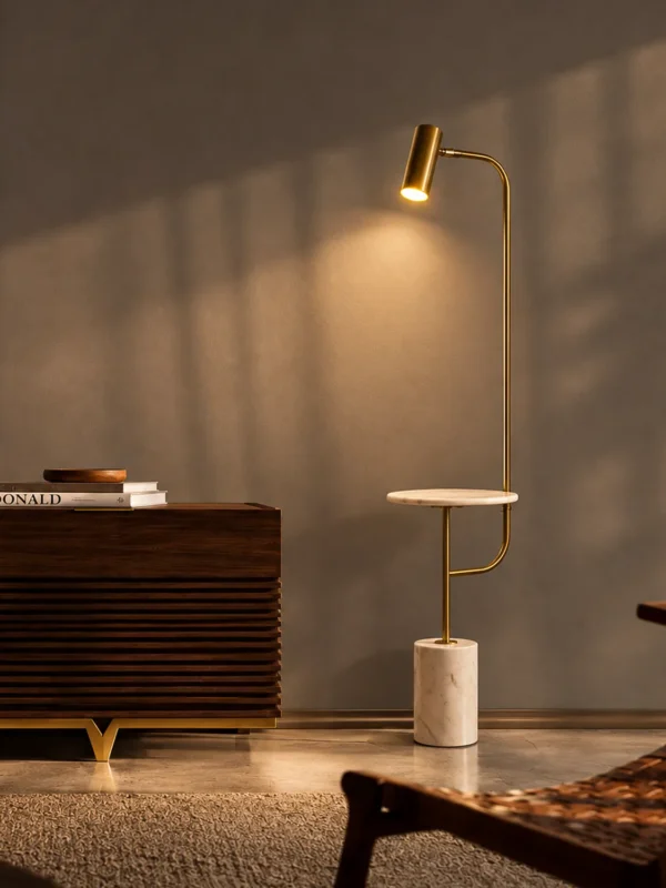 Radisson gold floor lamp with a white marble base beside a wooden cabinet in a contemporary interior