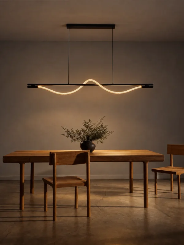Sicily wave-shaped LED chandelier suspended above a wooden dining table