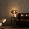 Silas table lamp providing warm ambient light in a contemporary living room