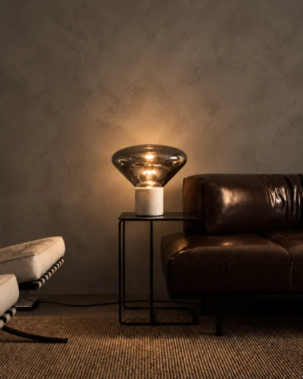 Silas table lamp providing warm ambient light in a contemporary living room