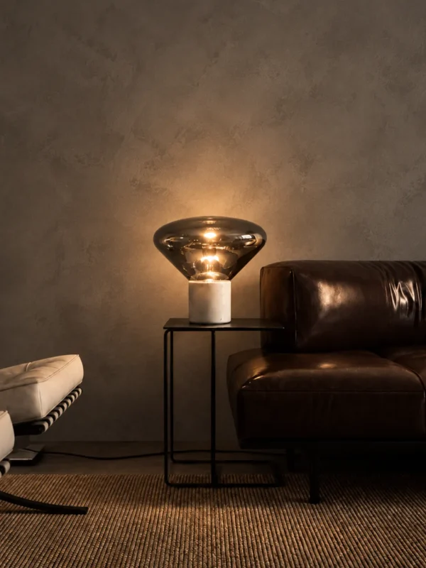 Silas table lamp providing warm ambient light in a contemporary living room