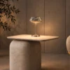Soren table lamp displayed on a side table in a contemporary interior