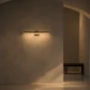 Suvi linear wall lamp illuminating a modern interior