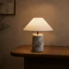 Venato Table Lamp Wooden Console Venato table lamp with tapered white shade and veined marble base on a wooden console