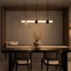 Viano linear chandelier with geometric marble accents in a contemporary interior