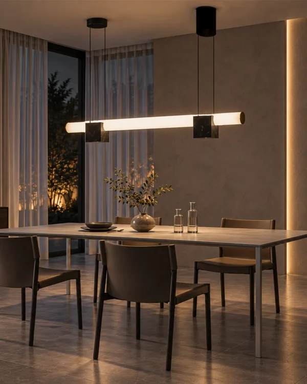 Viano linear chandelier with marble accents above a contemporary dining table