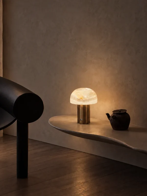 Vienna table lamp displayed on a stone console in a contemporary interior